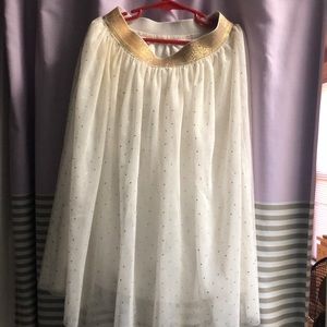 A Golden And White Skirt